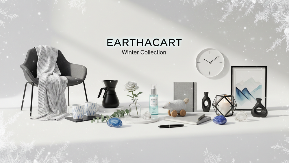 “Create a premium winter-themed banner for Earthacart with a clean white, grey, black, and icy blue palette. Add subtle winter elements like soft frosted textures or gentle snow-like highlights. Showcase home, kitchen, beauty, natrural gem stones,toys,stationary and décor products in a cozy, modern, minimal arrangement with soft shadows and premium lighting.” for exact hero image section